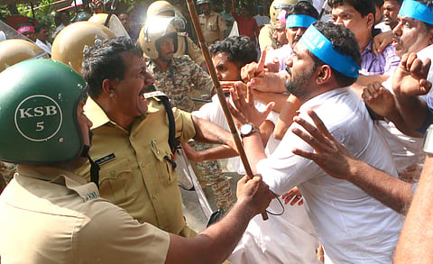 The police assault Congress workers protesting against the Citizenship (Amendment) Act in front of the Head Post Office in Kozhikode on Saturday | (Photo  | T P Sooraj, EPS)