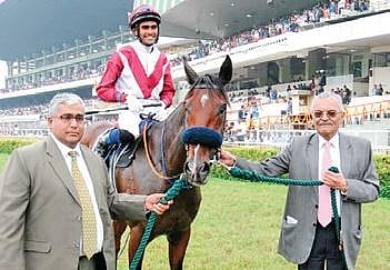 Horse owner Aditya Thackersey (right) with trainer Vittal Deshmukh. (Photo | EPS)