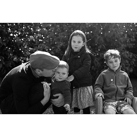 The adorable photo, captured by mom Kate, showed dad William planting a kiss on Prince Louis' cheek. (Photo | Insta)