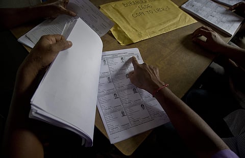 People check their names in the final list of the National Register of Citizens (NRC) at an NRC center in Assam. (Photo | AP)