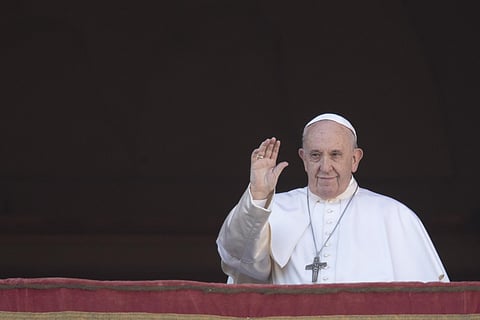 Pope Francis waves to faithful as he arrives to deliver the Urbi et Orbi (Latin for 'to the city and to the world' ) Christmas' day blessing from the main balcony of St. Peter's Basilica at the Vatican. (Photo | AP)