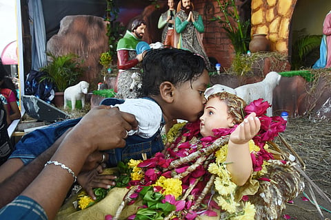 People offer prayer at Annai Vailankkanni Shrine at Besant Nagar on the eve of Christmas on Wednesday. (Photo | Ashwin Prasath, EPS)