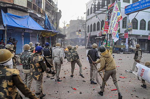 Police personnel clash with protestors during a rally against the Citizenship Amendment Act CAA in Kanpur. (Photo | PTI)