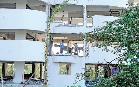 Holy Faith H2O, one of the apartments in Maradu which violated the CRZ norms, being demolished by Vijay Steels workers |  A Sanesh