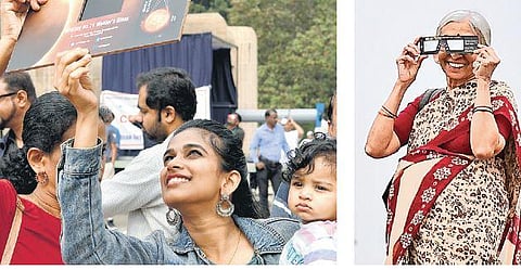 Enthusiastic people watch the solar eclipse at the Jawaharlal Nehru Planetarium in Bengaluru on Thursday. Right: An elderly woman enjoys the spectacle in Lalbagh | Meghana Sastry, Shriram B N
