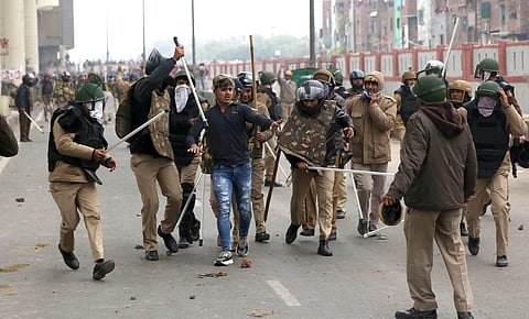 Police personnel detain an alleged protestor during a demonstration demanding withdrawal of CAA at Seelampur in New Delhi (File Photo | Shekhar Yadav/ EPS)