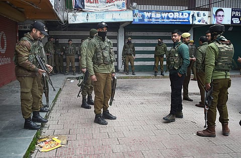 Senior police officials examine the spot of grenade blast hurled by militants in Srinagar. (File| PTI)