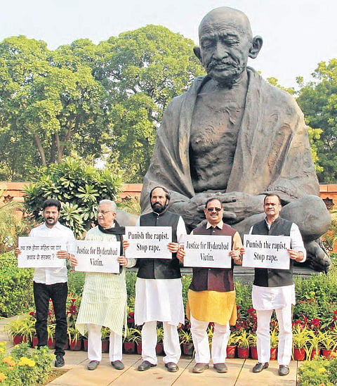 (From left) Malkajgiri MP A Revanth Reddy, Rajya Sabha MP MA Khan,  Nalgonda MP Uttam Kumar Reddy,  AICC Telangana in-charge RC Khuntia and Bhongir MP Komatireddy Venkat Reddy stage a dharna before Mahatma Gandhi’s statue on the Parliament premises seekin