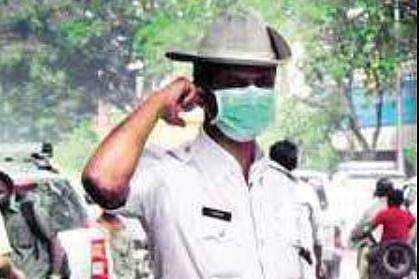 Traffic police across the city inhale polluted air, often leading to lung cancer
