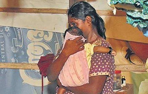 The woman with her infant child  at their shack | B P Deepu