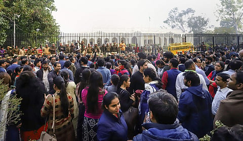 Members of Delhi University Teachers' Association DUTA protest outside VC's office demanding withdrawal of the circular mandating appointment of guest teachers in New Delhi Thursday. (Photo | PTI)