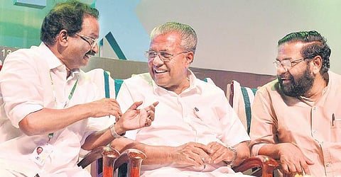 Chief Minister Pinarayi Vijayan, Cultural Affairs Minister A K Balan and Tourism Minister Kadakampally Surendran share   a light moment during the opening ceremony of International Film Festival of Kerala in T’Puram on Friday | Vincent Pulickal