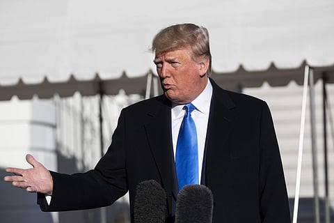 President Donald Trump speaks with reporters before boarding Marine One on the South Lawn of the White House