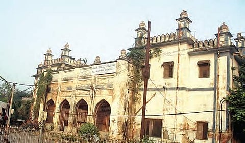 Plants seen growing in the building of Nizamia Tibbi Unani Hospital, Hyderabad, as the heritage building is left to perish  | Sathya keerthi