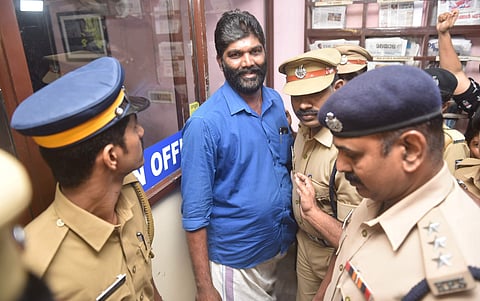Trivandrum Press club secretary, M Radhakrishnan being arrested from the Press Club. (Photo | Express)