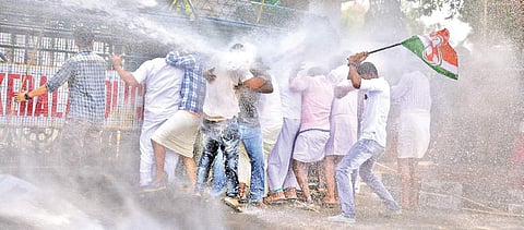 The police using water guns on the Youth Congress activists who took out a march to the Secretariat in protest against the killing of two Congress workers in Kasargod |  Vincent Pulickal