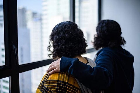Saudi sisters Rawan (in yellow), 18, and Reem, 20, (both using adopted aliases) stand next to each other during an interview with AFP in Hong Kong on February 22, 2019.  (Photo | AFP)