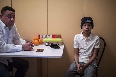 In this Thursday, Feb. 21, 2019 photo, Carlos Acosta and his son Jesus, sit at a hostel in Barcelona, Spain, where they have come for a bone marrow transplant and follow up care for the 12-year old child. (Photo | AP)