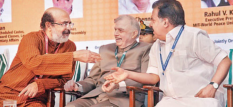 Governor P Sathasivam listens intently as Opposition leader Ramesh Chennithala and Finance Minister Thomas Isaac are engaged in animated discussion during Nat’l Students’ Parliament inauguration in T’Puram  on Saturday | Vincent Pulickal