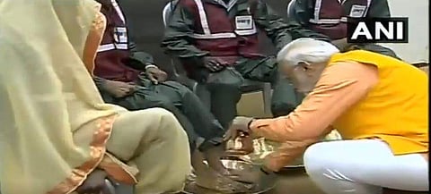 PM Narendra Modi washes feet of sanitation workers. (Photo| ANI)