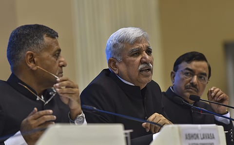 Chief Election Commissioner Sunil Arora along with Election Commissioners Ashok Lavasa (L) and Sushil Chandra (R) addresses a press conference to announce the poll schedule for the forthcoming Lok Sabha elections at Vigyan Bhavan in New Delhi Sunday March