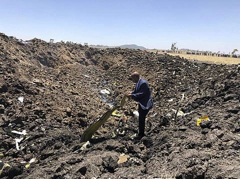 In this photo taken from the Ethiopian Airlines Facebook page, the CEO of Ethiopian Airlines, Tewolde Gebremariam, looks at the wreckage of the plane that crashed shortly after takeoff from Addis Ababa, Ethiopia, Sunday March 10, 2019.  (Photo | AP)