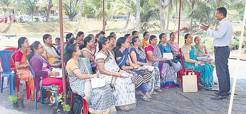 B Raghavendra delivers a talk on herbal plants at a workshop.