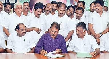 PT chief K Krishnasamy inks the poll pact in AIADMK coordinator O Panneerselvam’s presence.| Express