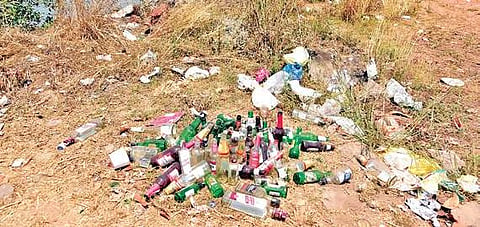 The area behind Sulthan Bathery which is littered with liquor,  bottles and garbage | Rajesh Shetty Ballalbagh