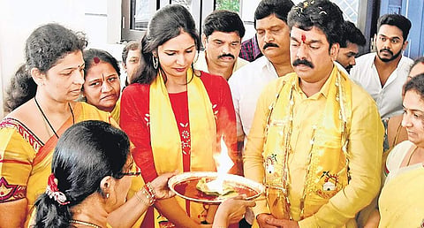 Bonda Umamaheswara Rao being offered Harathi by his wife in Vijayawada on  Wednesday before filing his nomination papers I P Ravindra Babu