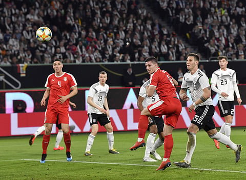 Serbia's Luka Jovic(TR) scores his side's goal during a international friendly against Germany at the Volkswagen Arena stadium in Wolfsburg (Photo | AP)