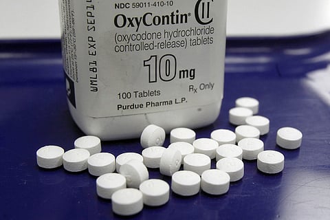 OxyContin pills arranged for a photo at a pharmacy in Montpelier, Vt. Oklahoma's attorney general will announce a settlement Tuesday, March 26, 2019, with Purdue Pharma, one of the drug manufacturers named in a state lawsuit that accuses them of fueling t