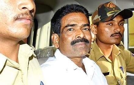 Serial killer Cyanide Mohan who is accused of murdering 20 women, being escorted at Court premises on Friday | Rajesh Shetty Ballalbagh.