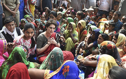 Congress General Secretary and Uttar Pradesh - East incharge Priyanka Gandhi Vadra interacts with villagers on her three-day campaigning ahead of Lok Sabha elections in Ayodhya. (Photo | PTI)