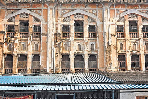 Decorated arches and jalis adorning the windows seen in a dilapidated state at Osmania General Hospital