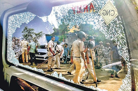 Videos surfaced showing police personnel being chased around by a mob, pelting stones at them and hurling abuses. (Photo | PTI)