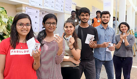 First time voters show their finger marked with indelible ink, after casting their vote at Agarwal Vidyala in EVK Sampath Salai, Chennai.(Photo | Martin Louis,EPS)