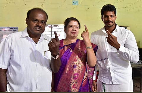 Karnataka Chief Minister H D Kumaraswamy, with his wife Anitha Kumaraswamy and son Nikhil Gowda.