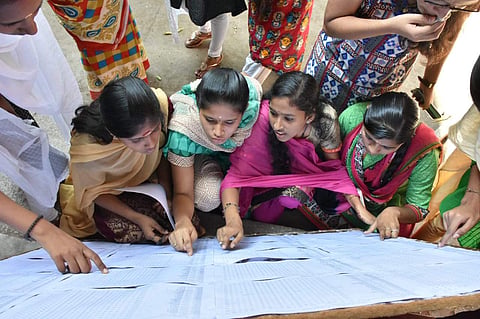 Students checking result at a school in Coimbatore. (Photo | U Rakesh Kumar, EPS)