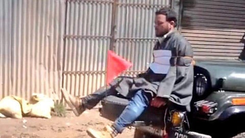 A file photo showing Farooq Ahmad Dar tied to the front of an Army jeep