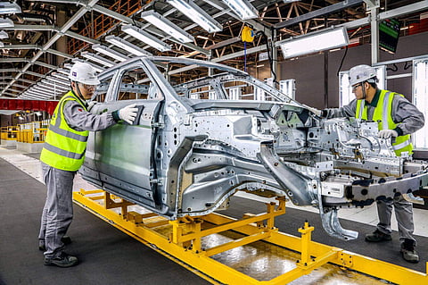 Technicians working in Jaguar Land Rover plant. 