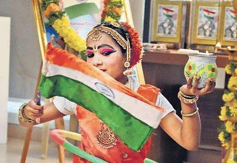 A little girl performs a ring dance with fire pots in her hand during National Flag Day celebration in city on Monday (Photo |  RVK Rao/EPS)