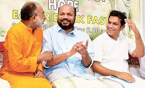 Ernakulam Lok Sabha candidates Alphonse Kannanthanam (NDA), P Rajeev (LDF) and Hibi Eden (UDF) sharing a light moment at the inter-religious Easter celebration held at Chavara Cultural Centre in Kochi  Express