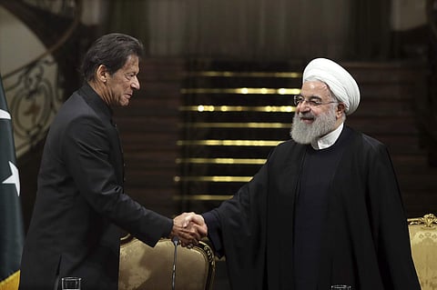 President Hassan Rouhani, right, and Pakistani Prime Minister Imran Khan, shake hands after a joint press briefing at the Saadabad Palace in Tehran, Iran, Monday, April 22, 2019. (Photo | AP)