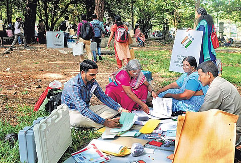 Election officers, after collecting polling materials, verifying the contents at Maharaja’s College on Monday | A Sanesh