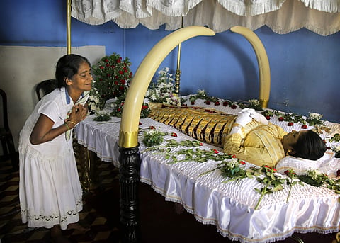 Harshani Sriyani weeps over the body of her daughter who was killed in the Easter Sunday bombings in Colombo, Sri Lanka on 23 April 2019. (Photo | AP)