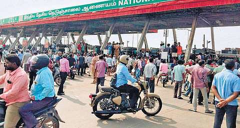 Villagers and drivers stage a blockade at the Redhills toll plaza on the Chennai-Kolkata highway | Express