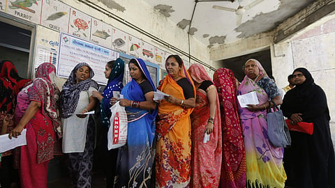 Women queued up to cast their vote for the general election.  