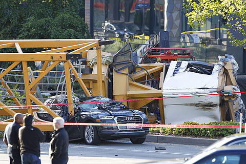Emergency crews work at the scene of a construction crane collapse where several people were killed and others were injured (Photo|AP)
