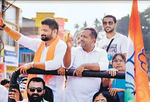 Dakshina Kannada Congress candidate Mithun Rai, accompanied by Minister  U T Khader  campaigned while sporting a saffron shawl recently